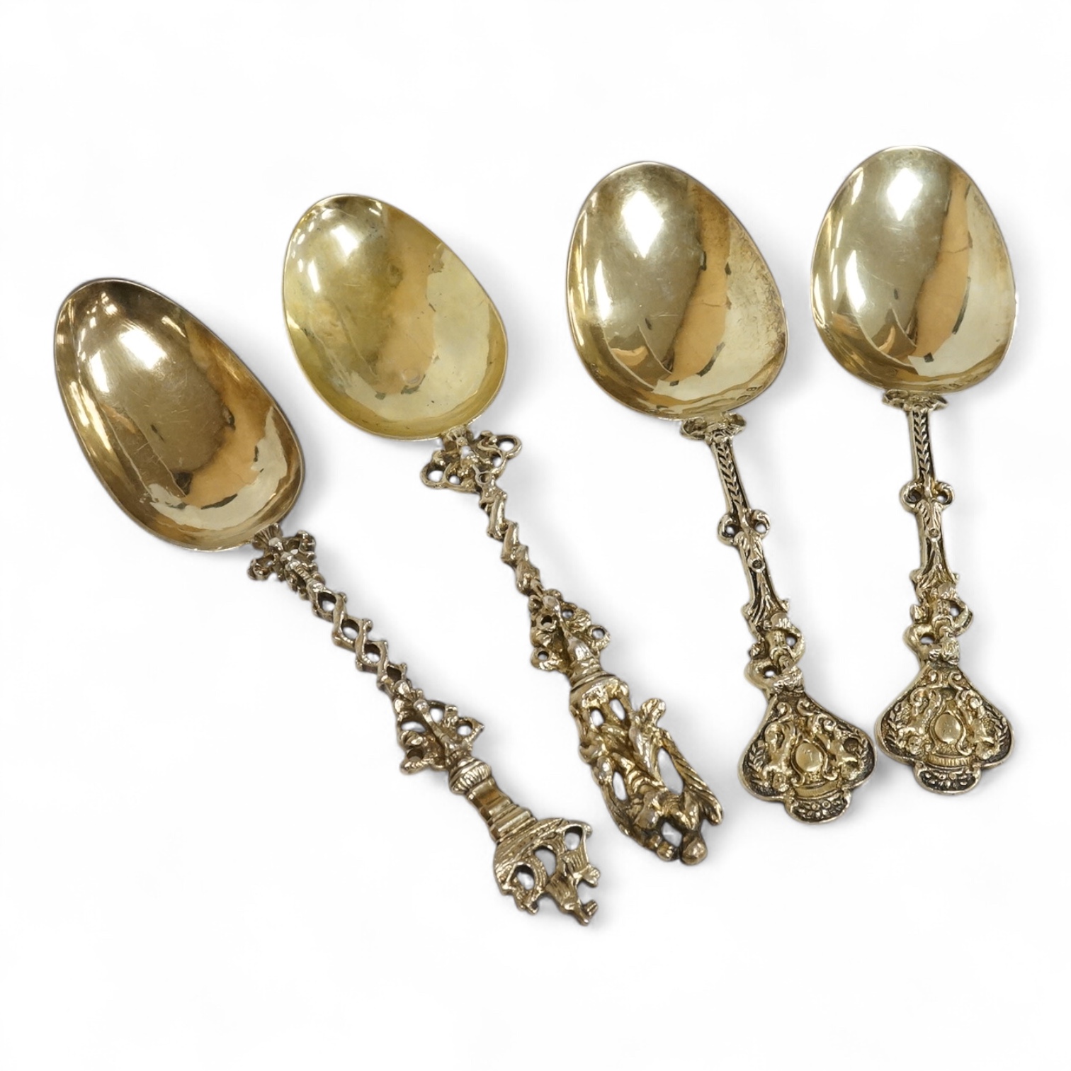 Four 19th century Dutch gilt white metal spoons, including a pair with import marks for Louis Landsberg, London, 1890, 83mm, 7.2oz.